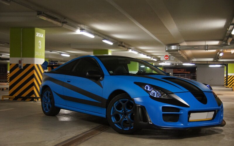 Blue Sports Car — Parking Garage