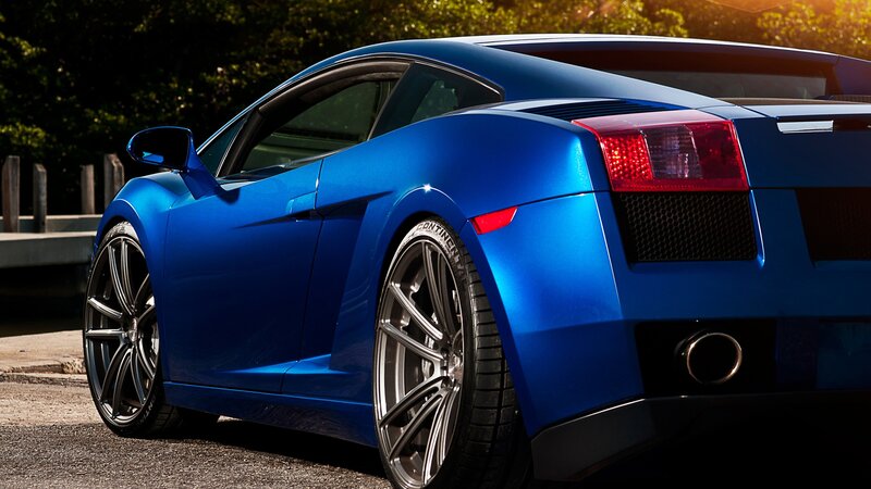 blue sports car rear view