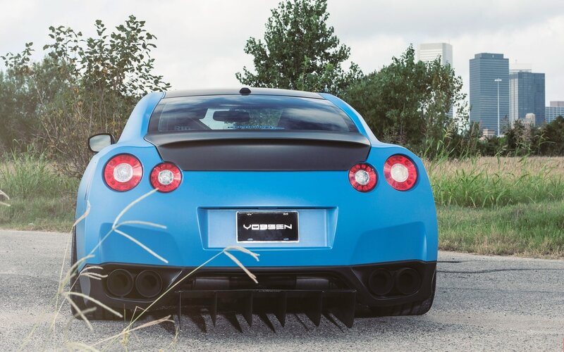 blue sports car rear view