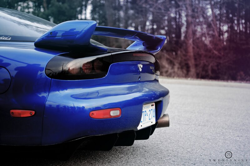 blue sports car rear view