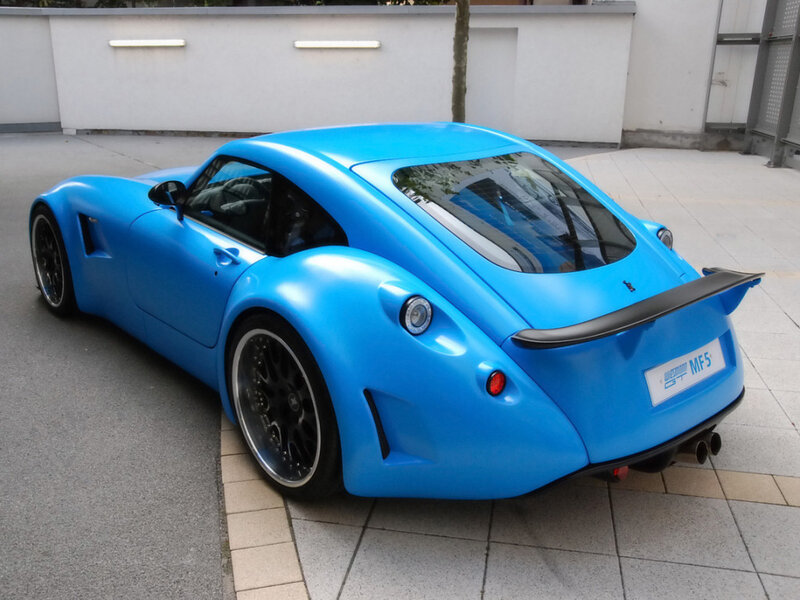 blue sports car rear view