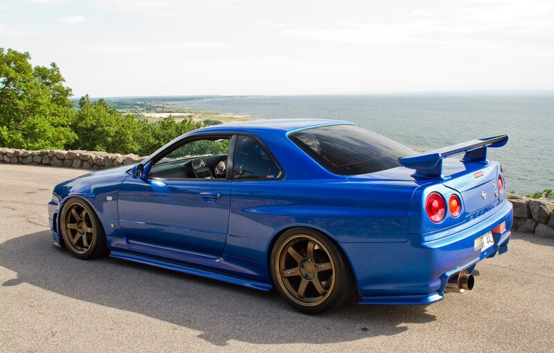 Blue Sports Car — Serene, Afternoon, Photograph, Ocean