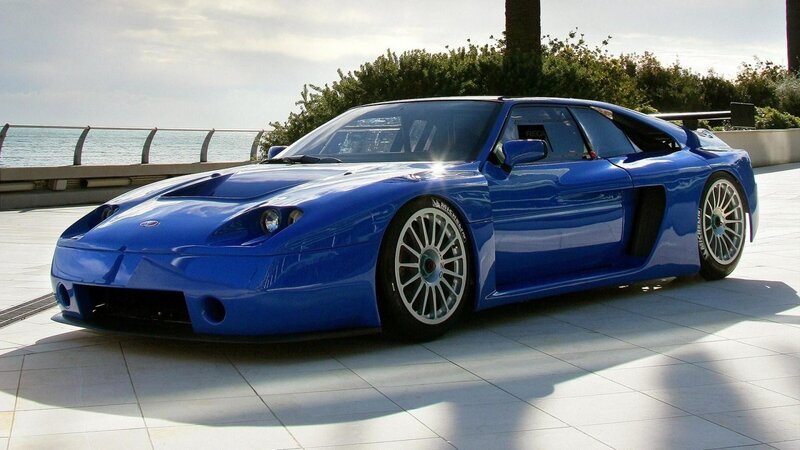 Blue Sports Car — Serene, Afternoon, Photograph, Ocean, Trees