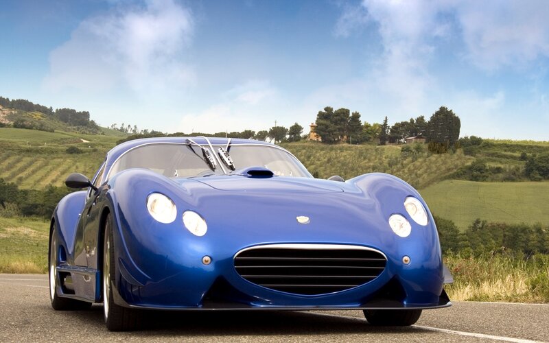 Blue Sports Car — Serene, Afternoon, Photograph, Road
