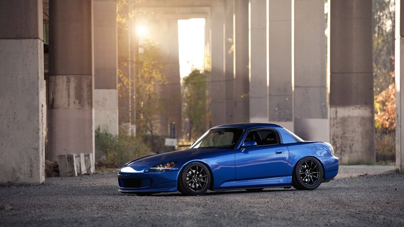 blue sports car under bridge