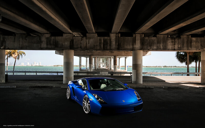 Blue Sports Car under Bridge — Dramatic