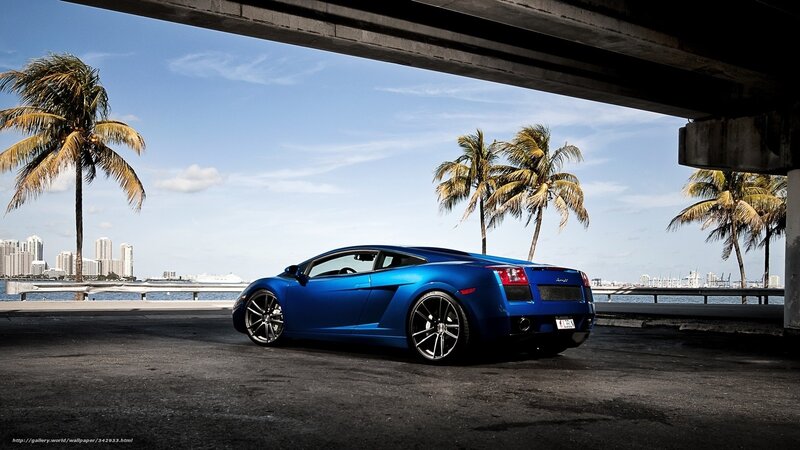 Blue sports car under bridge
