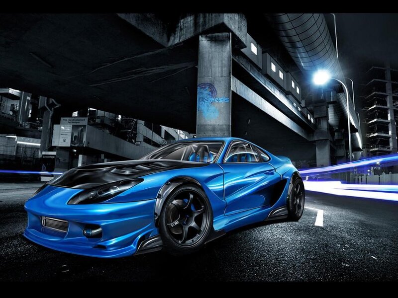 Blue sports car under highway