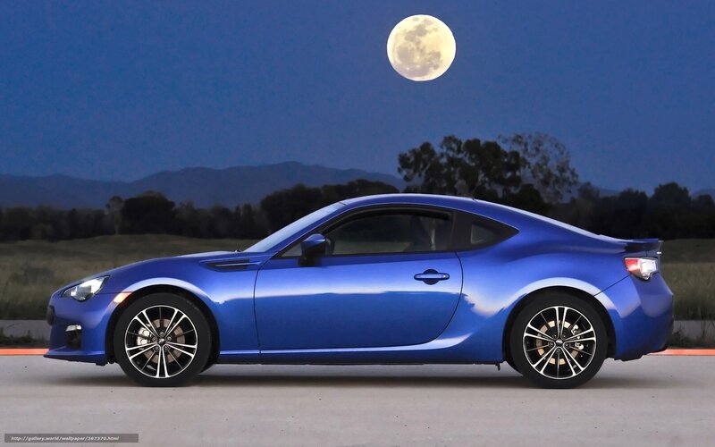 Blue sports car under moonlight