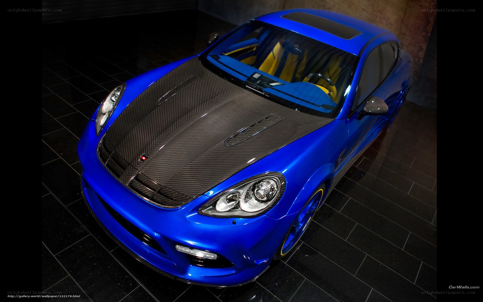 blue sports car with carbon fiber hood