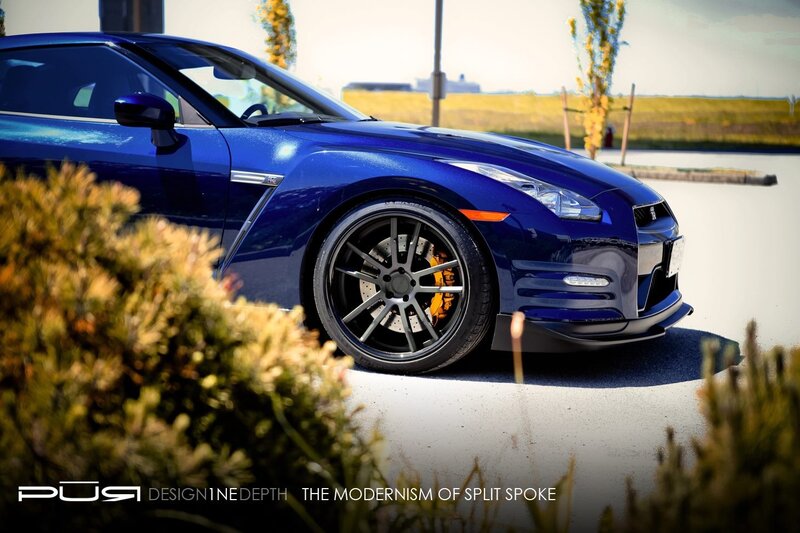 Blue sports car with custom wheels