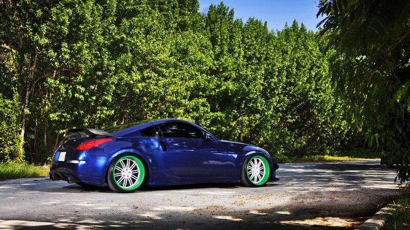 blue sports car with green wheels