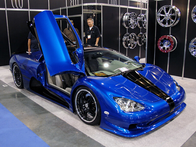 Blue sports car with open door