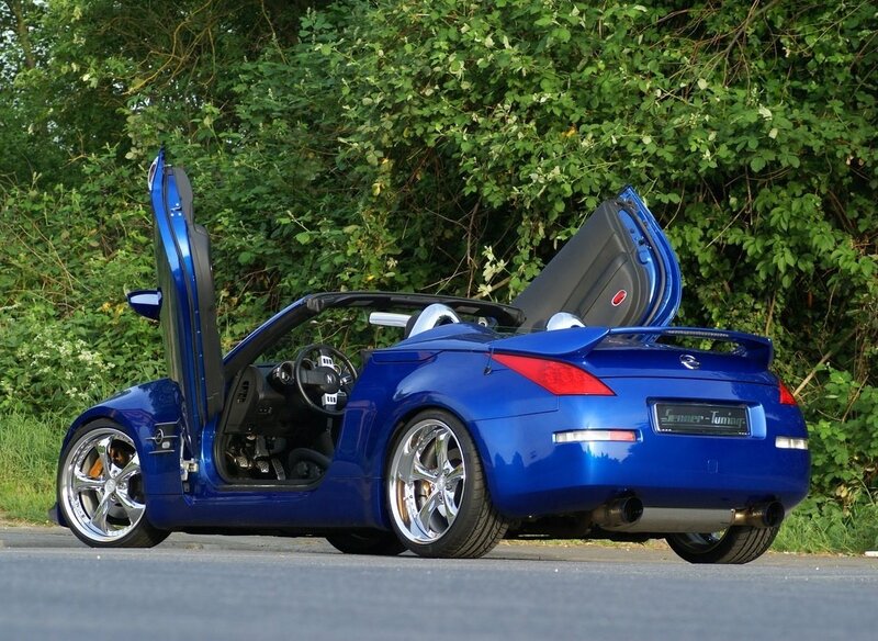 blue sports car with open doors