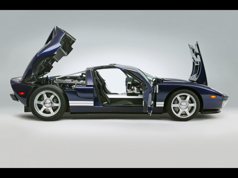 blue sports car with open doors