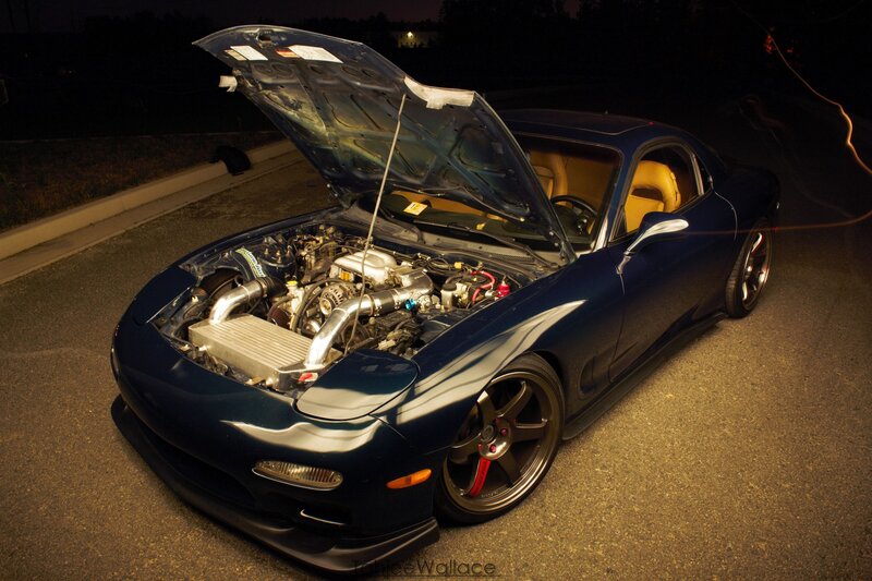 blue sports car with open hood