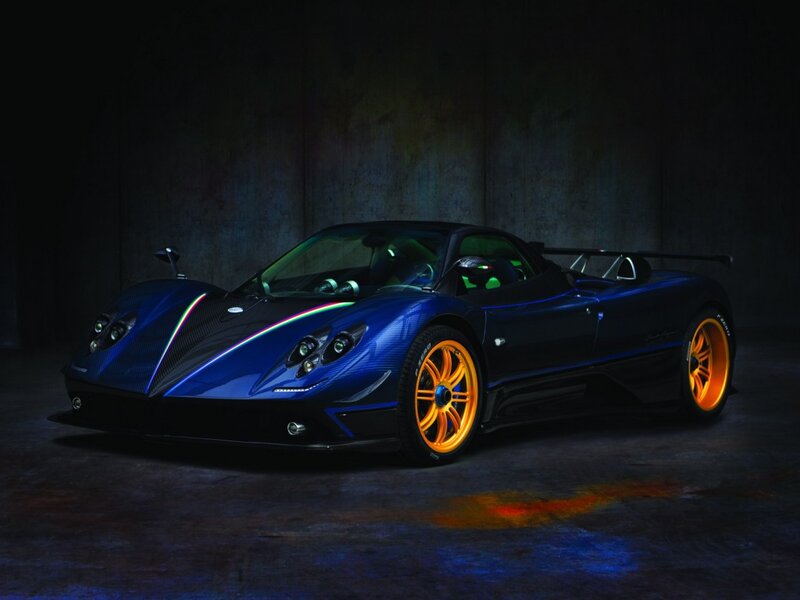 blue sports car with orange wheels
