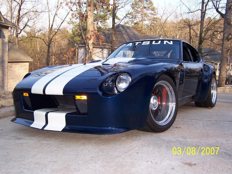 blue sports car with stripes