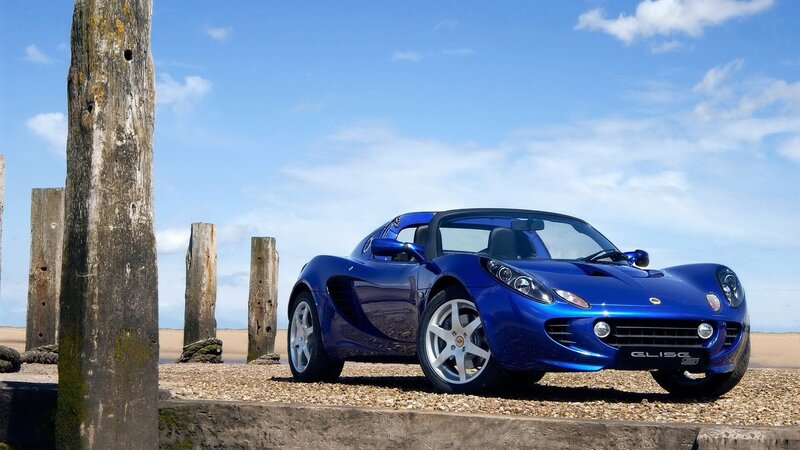 Blue Sports Car — Wooden Posts