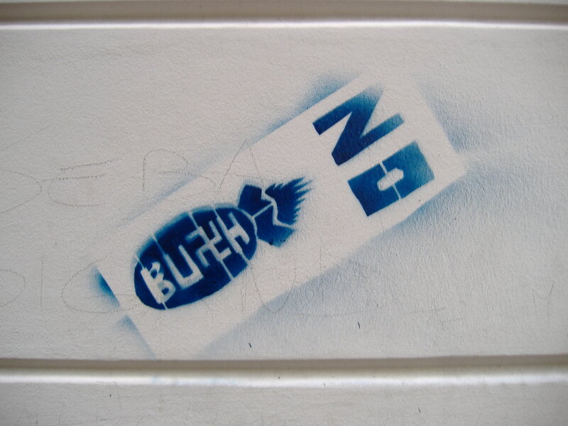 blue spray-painted logo