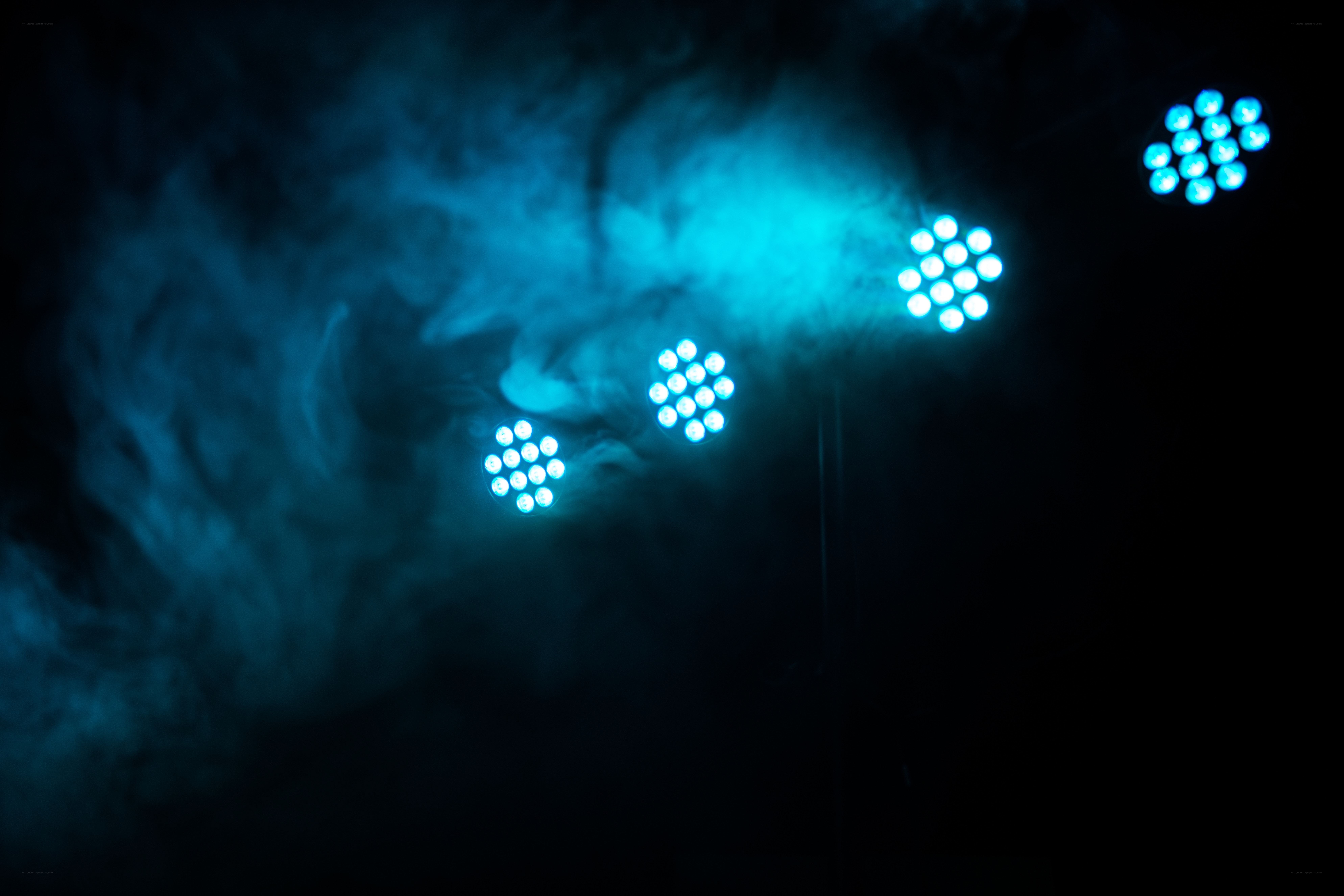Blue stage lights in smoke