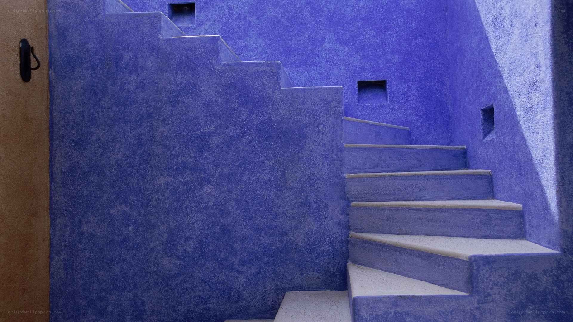 blue staircase in a courtyard
