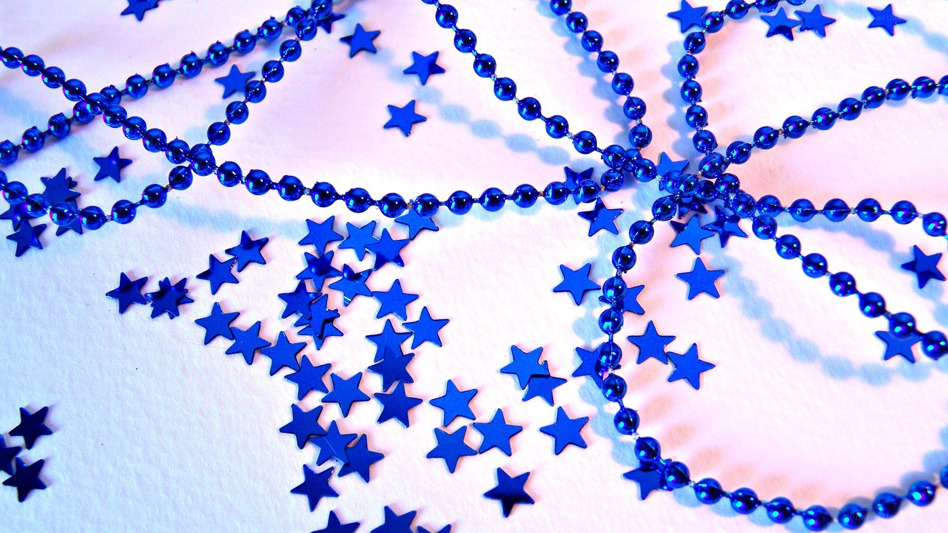 Blue star decorations on white