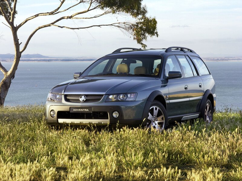 Blue station wagon by the sea