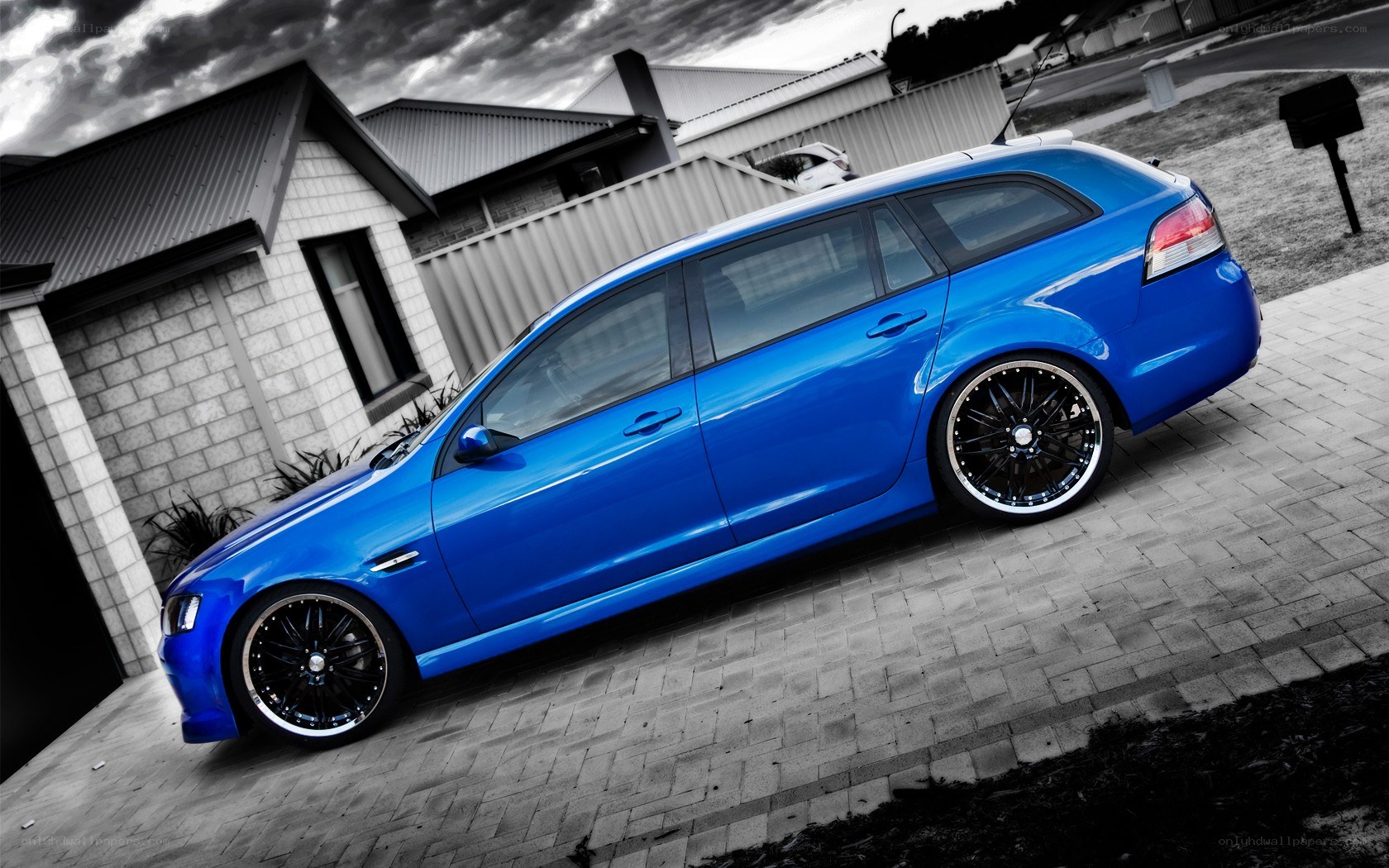 blue station wagon on driveway