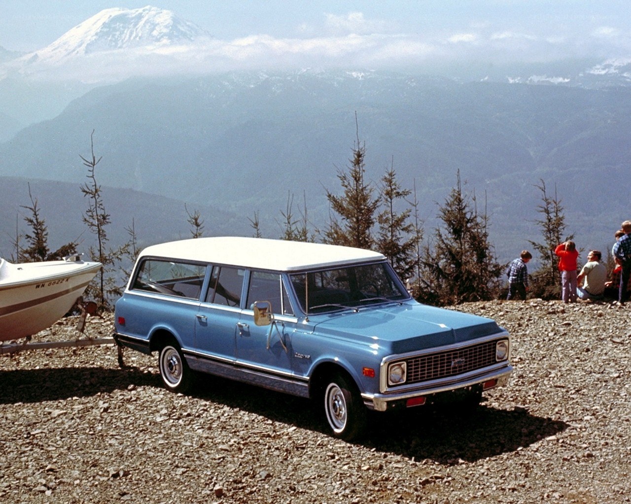 Blue station wagon with boat
