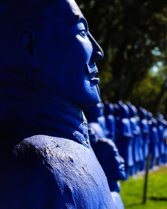 Blue Statues in a Row