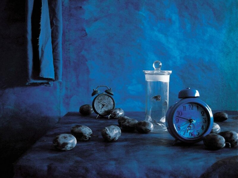 Blue still life with clocks and plums