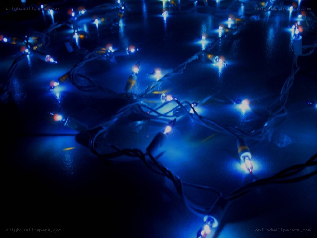 blue string lights on dark surface
