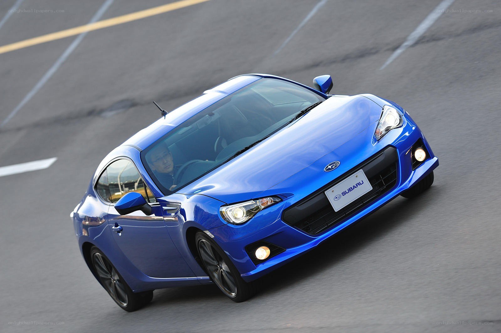 blue subaru brz in motion