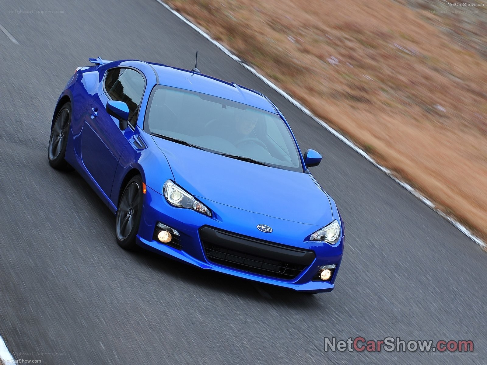 blue subaru brz in motion