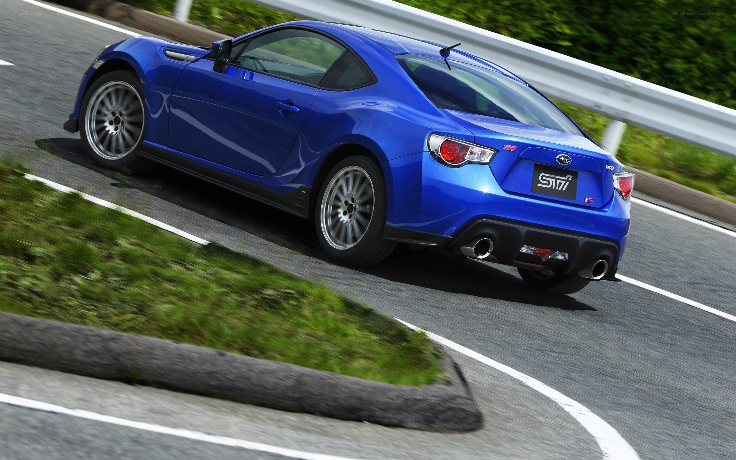 blue subaru brz in motion