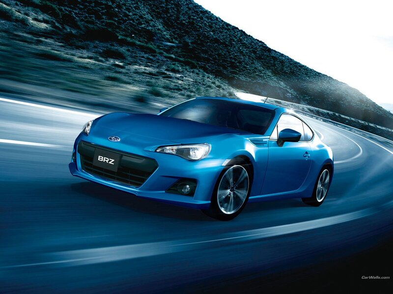 Blue Subaru BRZ on a winding road