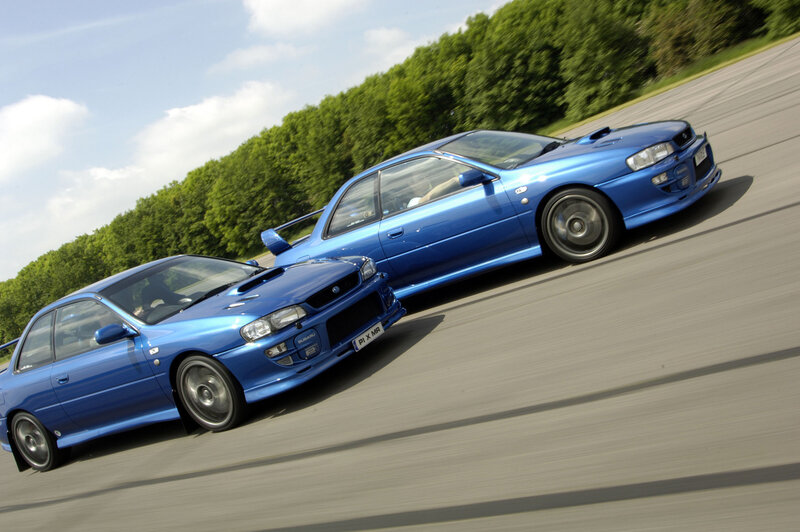 Blue Subaru cars racing