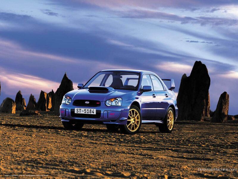 Blue Subaru in desert landscape