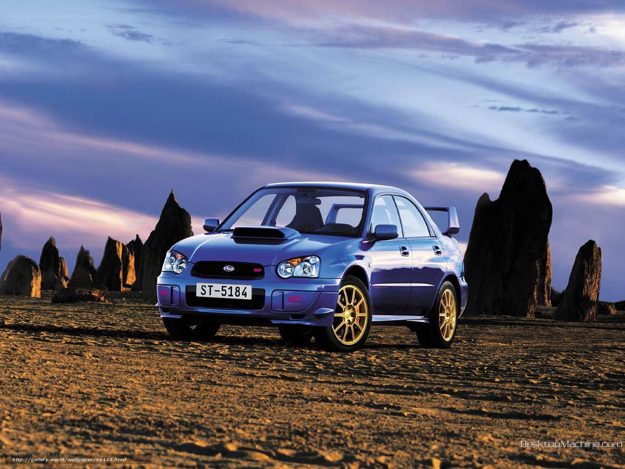 Blue Subaru in desert landscape