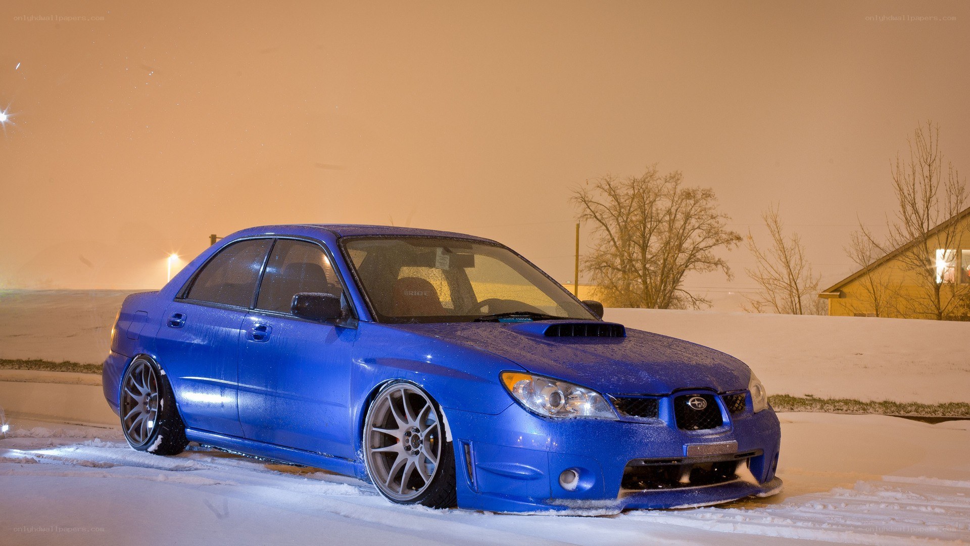blue subaru in snow