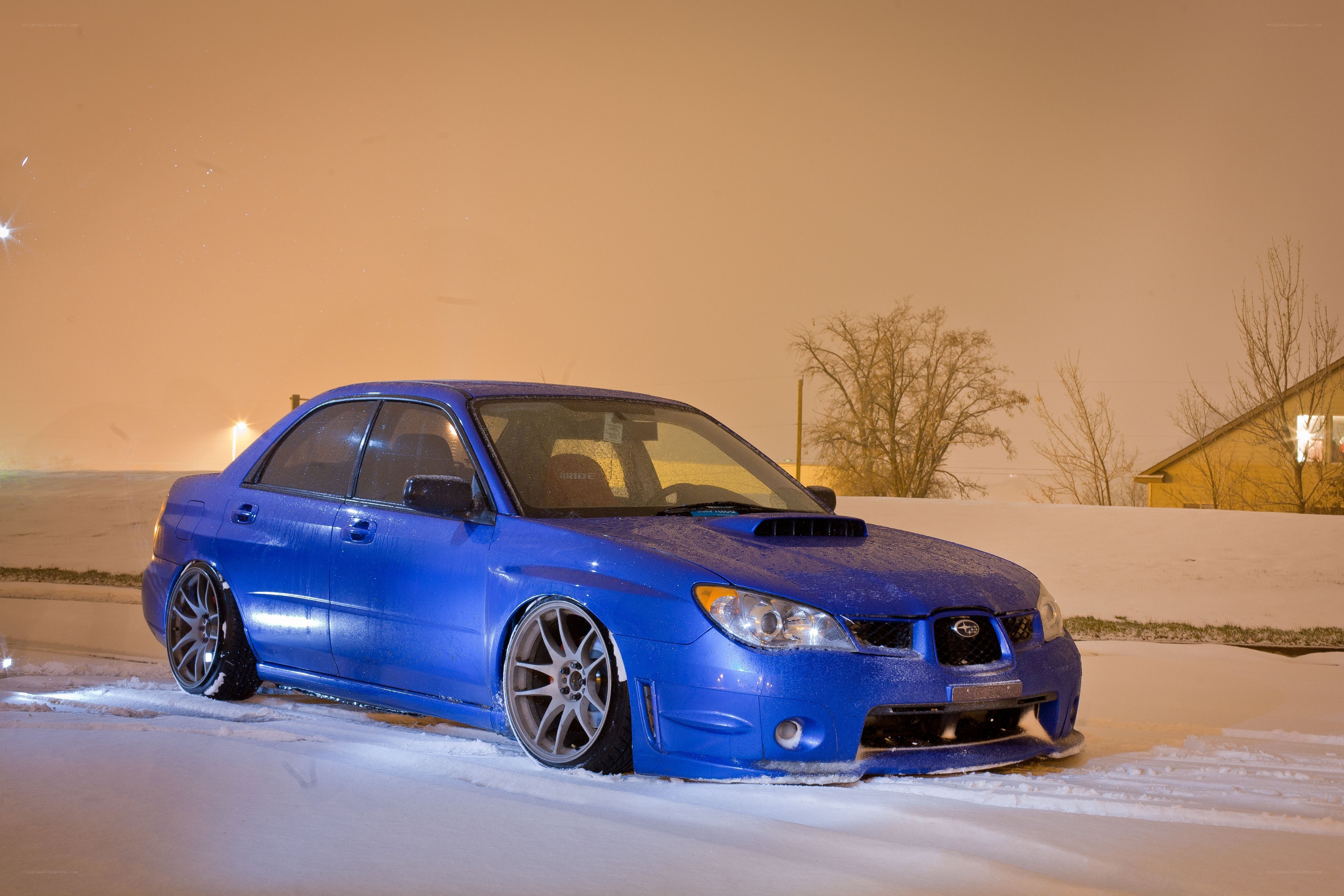 blue subaru in snow