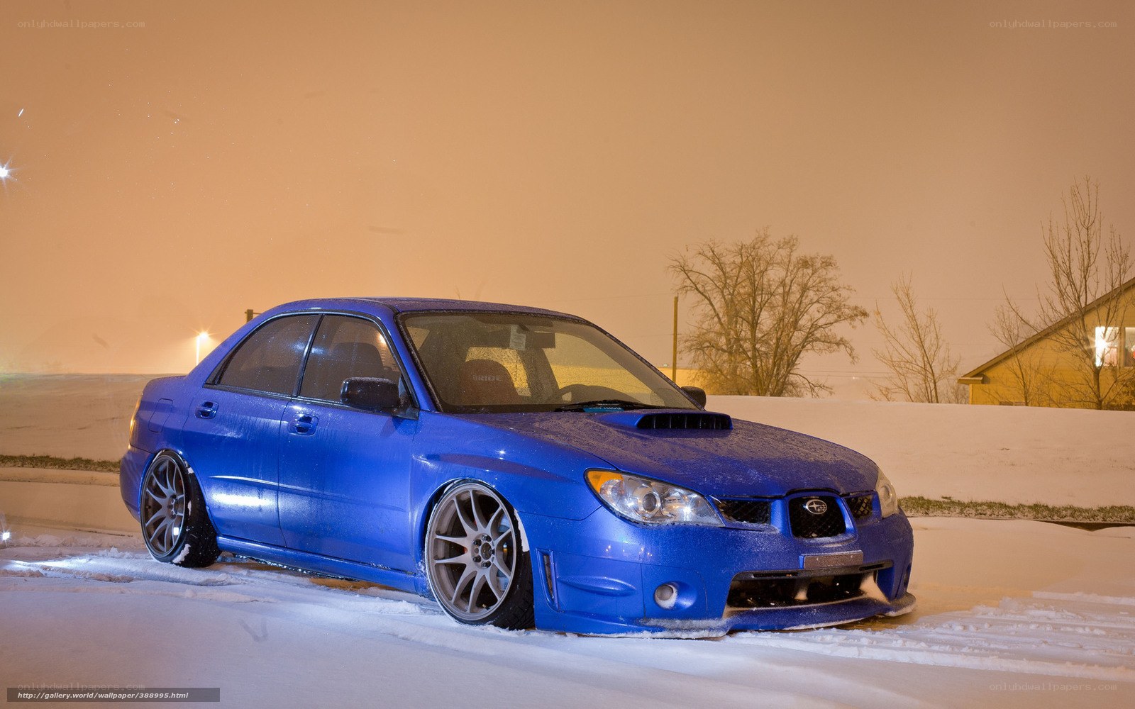 blue subaru in snow