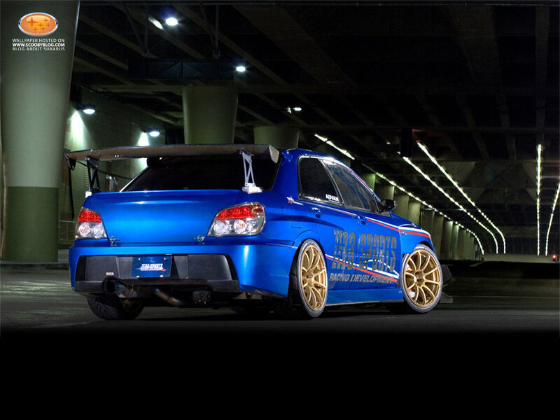 blue subaru in tunnel