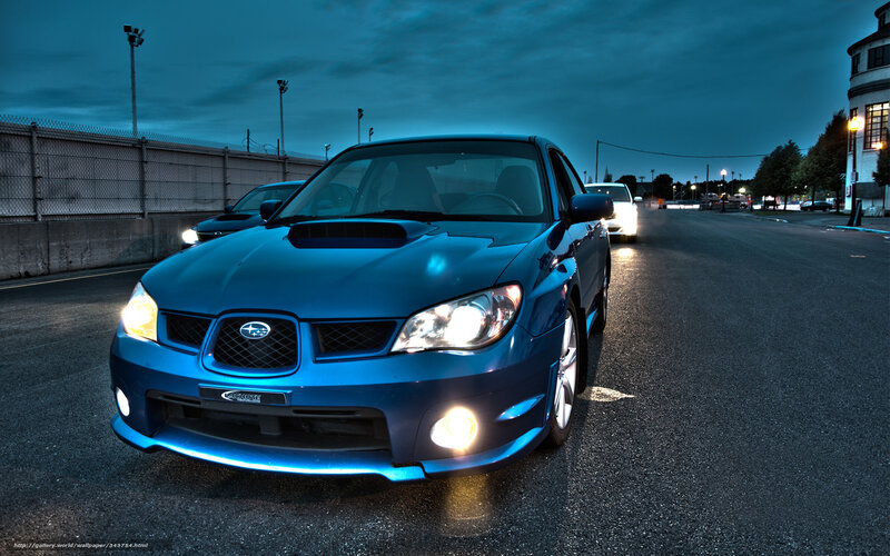 Blue Subaru on a racetrack