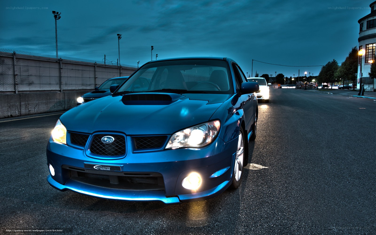 Blue Subaru on a racetrack