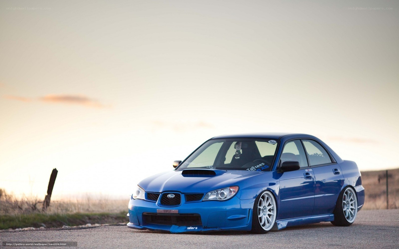 blue subaru on a road