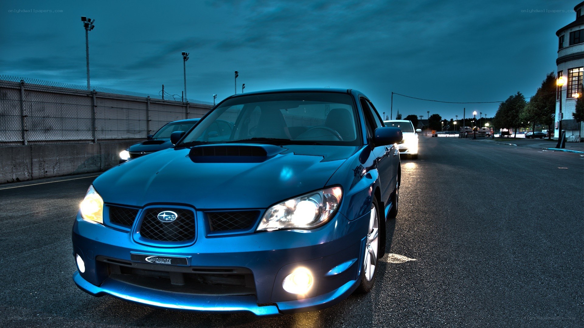 blue subaru on a track