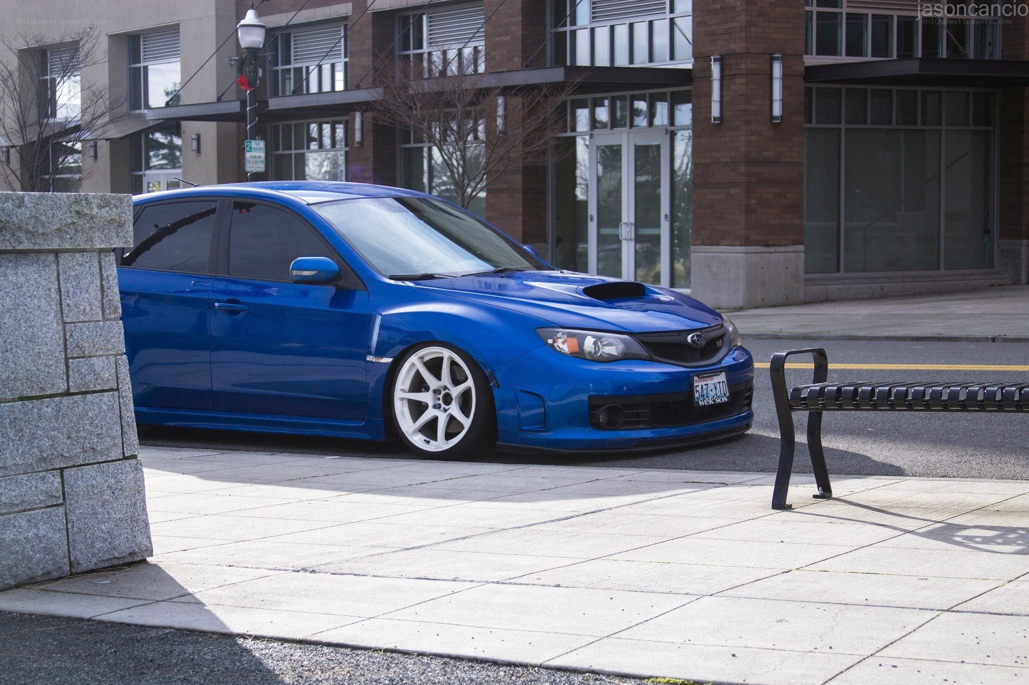 blue subaru on city street