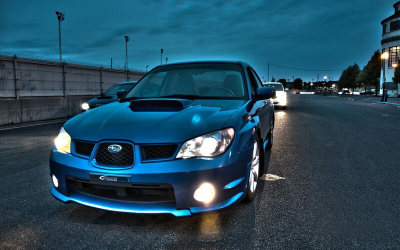 blue subaru on racetrack